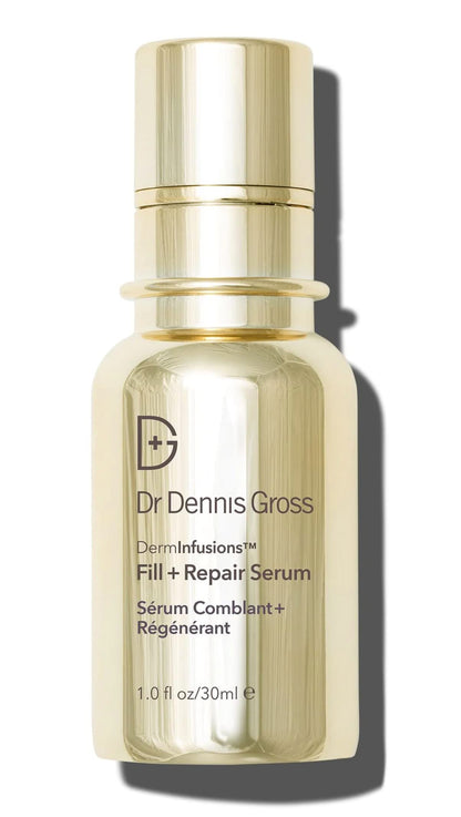 A bottle of Dr. Dennis Gross DermInfusions Fill + Repair Serum with a gold-colored label and a clear, amber liquid visible inside.