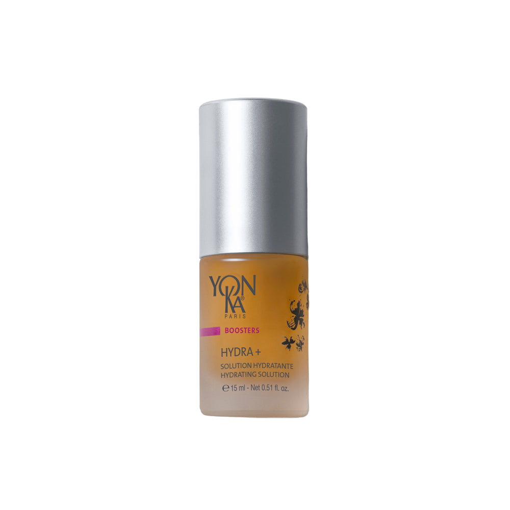 Skincare bottle with silver cap and brown body on a white background